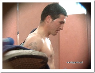 horny tattooed guy changing in a cubicle sneakypeek (1)